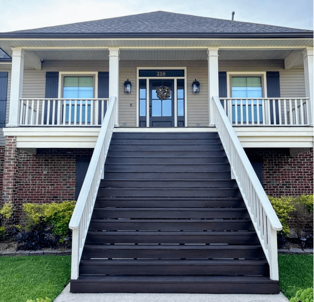 House with large front steps and porch.
